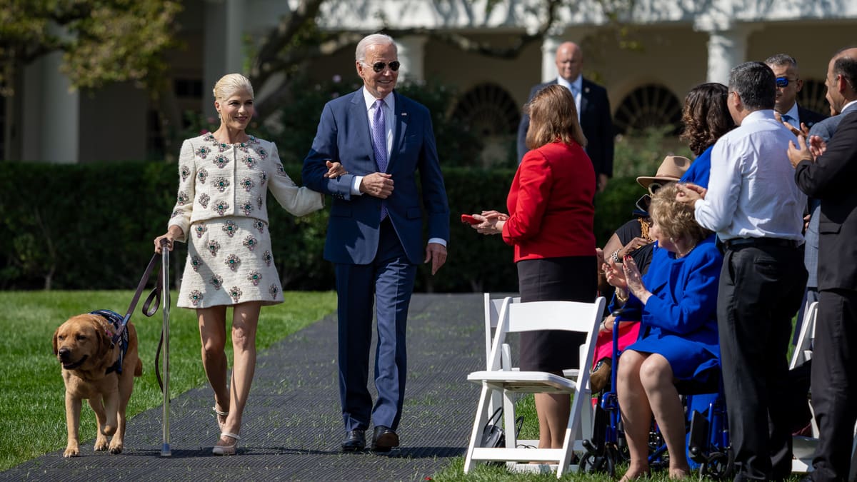 Selma Blair walks with Scout and Joe Biden on the White House South Lawn in October 2023.